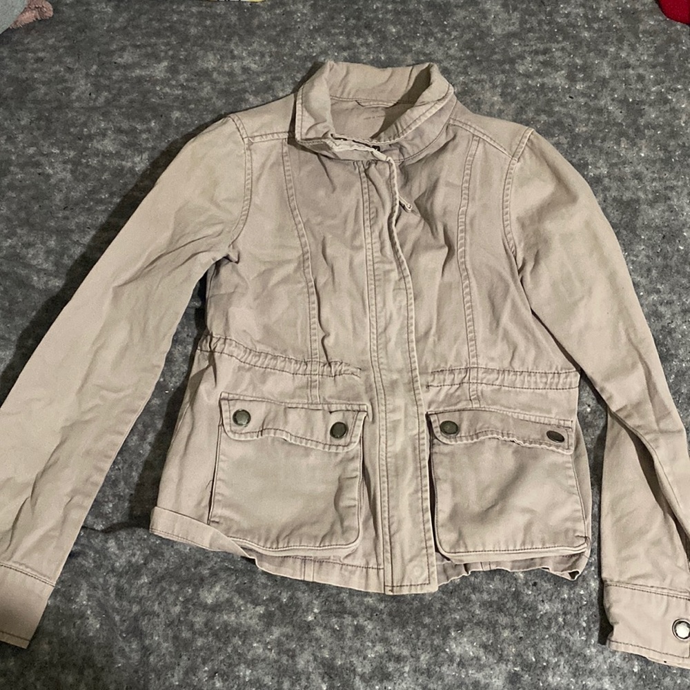 Light pink or tan Aeropostale jacket. It is an xs